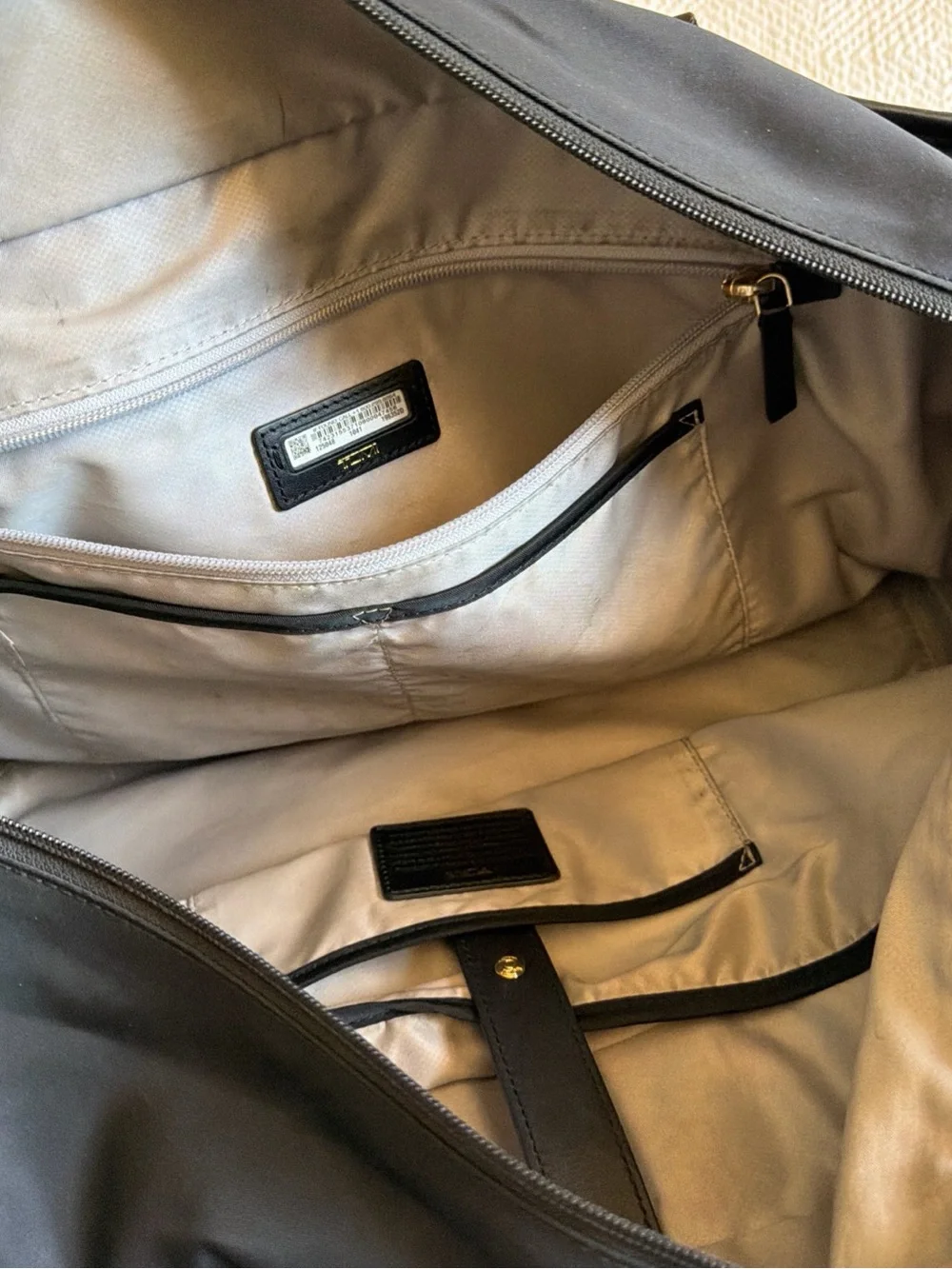 Tumi Black Duffel Bag with Gold Hardware